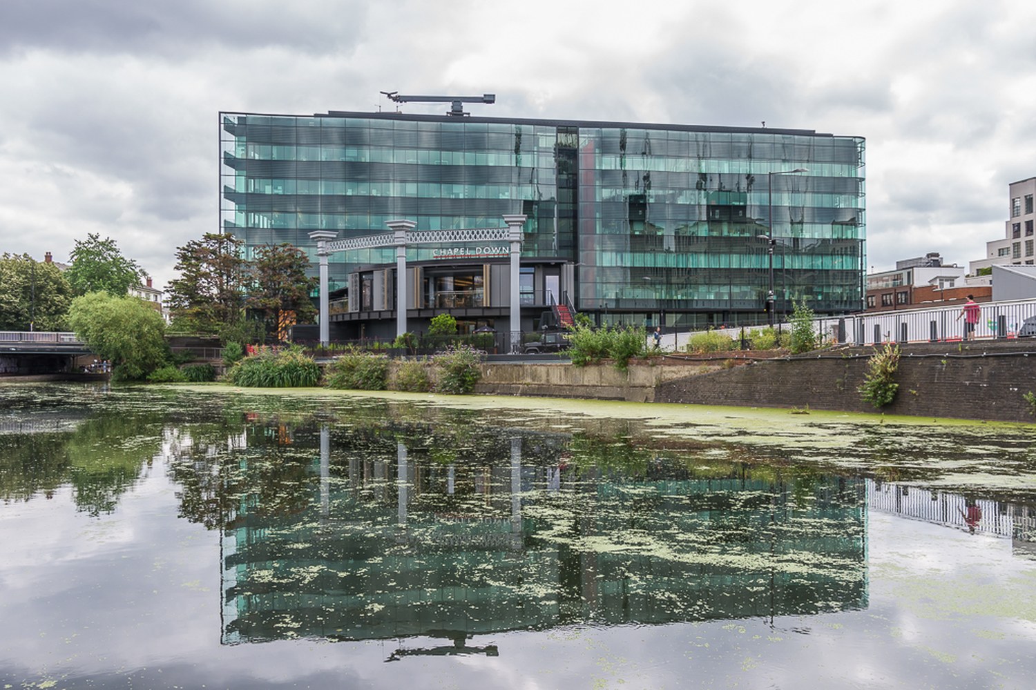 Glass façade of Kings Place beside Regent’s Canal