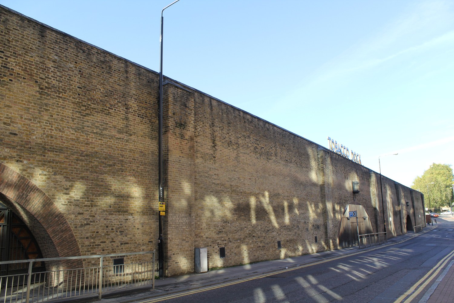 Long historic brick elevation of Tobacco Dock