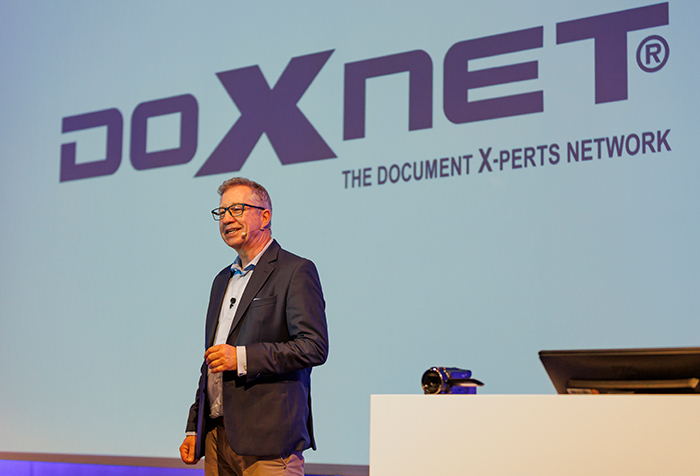 Jan Ditgen speaking about AI at a corporate event