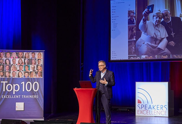 AI speaker Jan Ditgen delivering a keynote